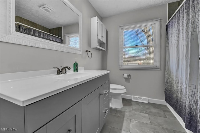 full bath featuring visible vents, a textured ceiling, toilet, and tile patterned flooring