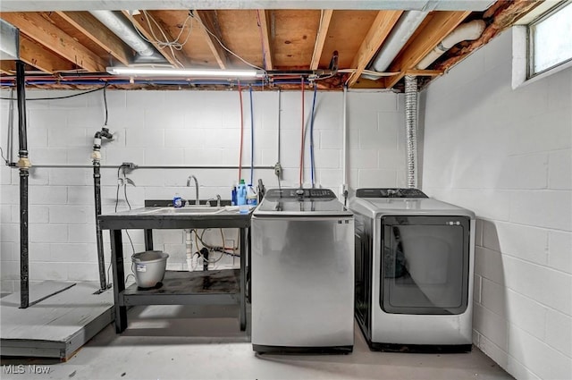 washroom featuring laundry area and washing machine and dryer