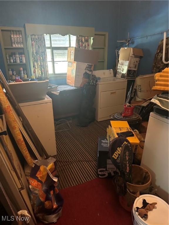 miscellaneous room with washer and clothes dryer and carpet floors