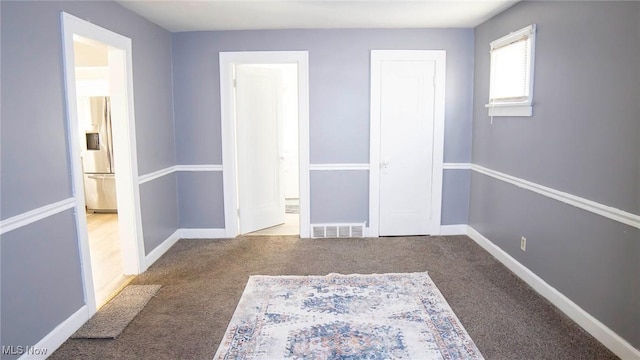 interior space with visible vents and baseboards