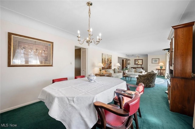 dining space with baseboards, an inviting chandelier, and dark colored carpet