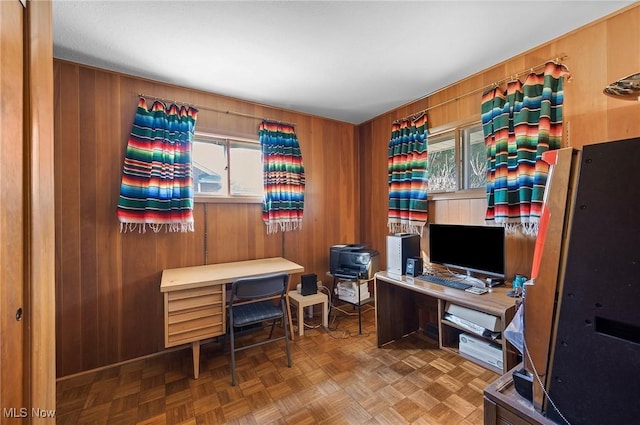 office area featuring wooden walls