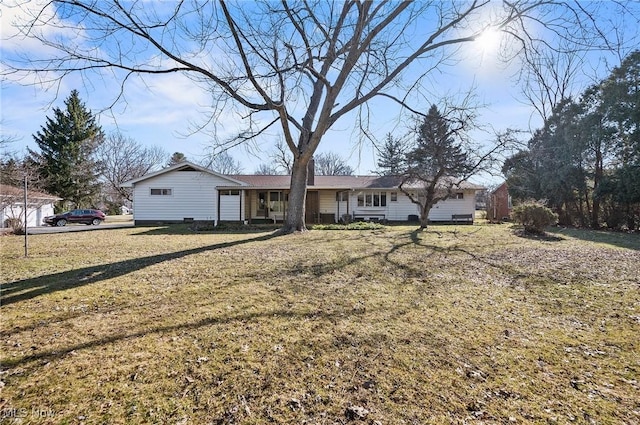 ranch-style home featuring a front yard