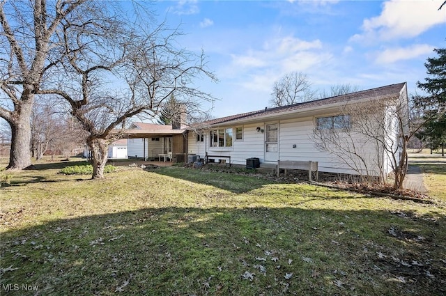 back of house featuring a yard