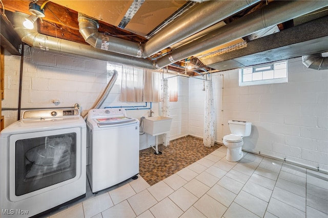 laundry room with washer and dryer and laundry area