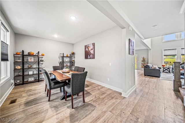 dining room with recessed lighting, visible vents, baseboards, and wood finished floors