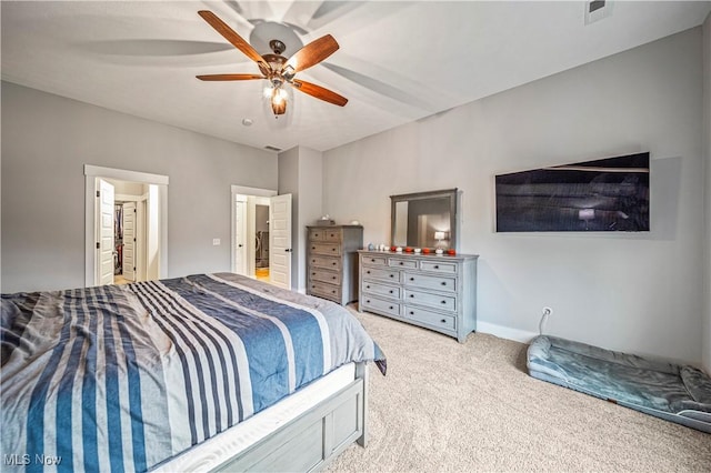 bedroom with a ceiling fan, visible vents, and light carpet