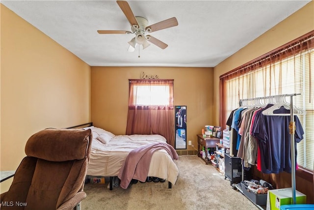 carpeted bedroom with ceiling fan