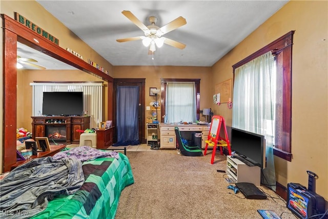 bedroom with carpet and a ceiling fan