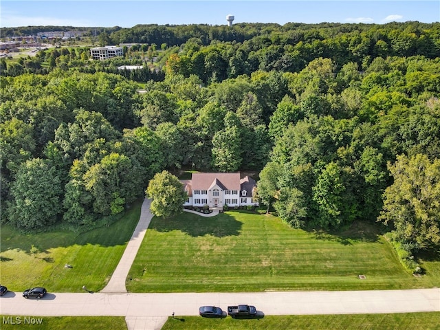 bird's eye view featuring a forest view