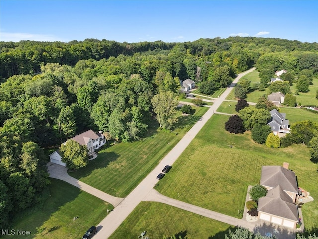 drone / aerial view featuring a forest view