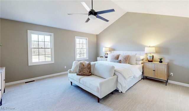 bedroom with baseboards, light colored carpet, and vaulted ceiling