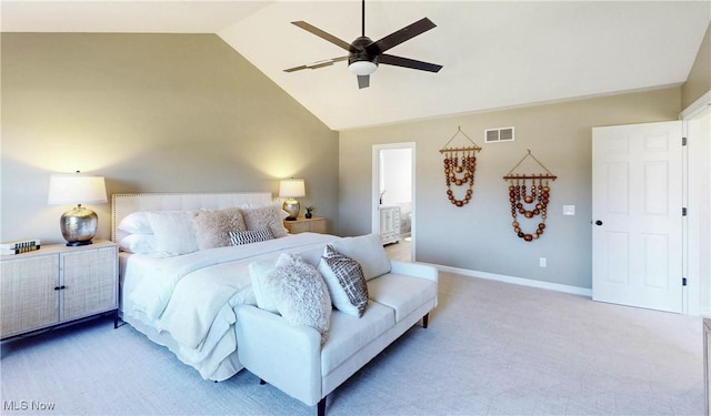 bedroom with visible vents, ceiling fan, baseboards, vaulted ceiling, and light carpet