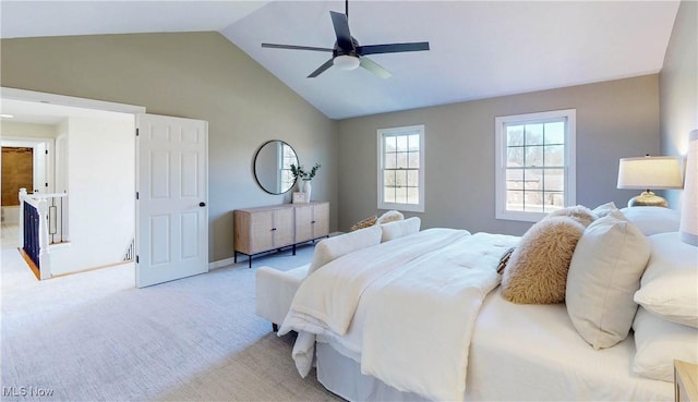 bedroom with light carpet, ceiling fan, and vaulted ceiling