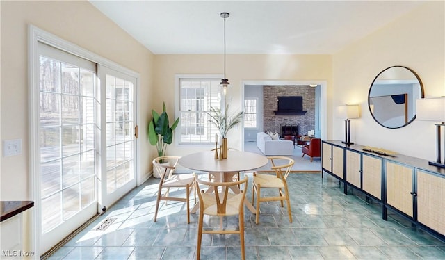 dining space with a fireplace