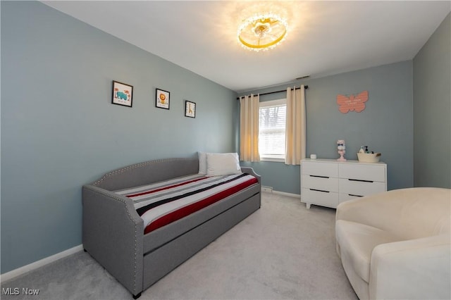 bedroom with visible vents, light colored carpet, and baseboards