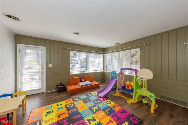 rec room featuring plenty of natural light, wood finished floors, and visible vents