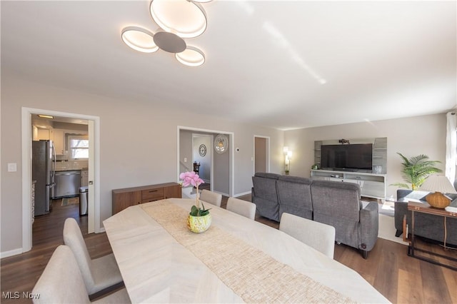 dining room with wood finished floors and baseboards