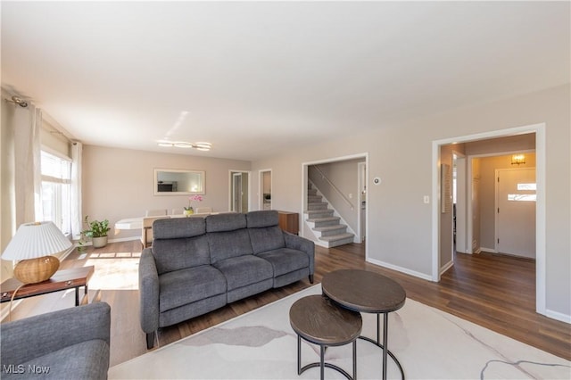 living room featuring wood finished floors and baseboards