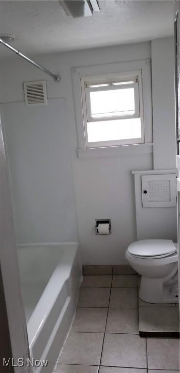 full bath featuring a bath, visible vents, tile patterned flooring, a shower, and toilet