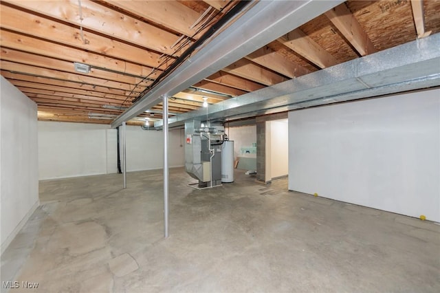 basement featuring gas water heater and heating unit