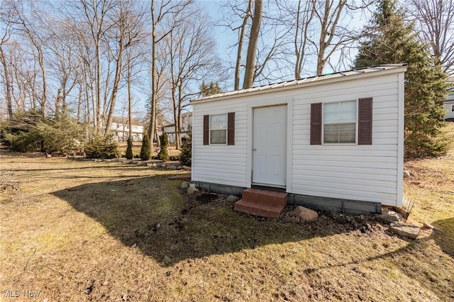 view of outbuilding with entry steps and an outbuilding