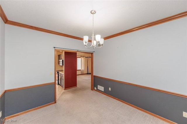 unfurnished room with visible vents, carpet, an inviting chandelier, and ornamental molding