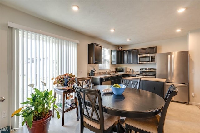 kitchen featuring recessed lighting, appliances with stainless steel finishes, and a sink