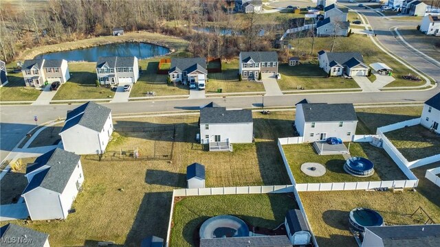 bird's eye view featuring a residential view and a water view