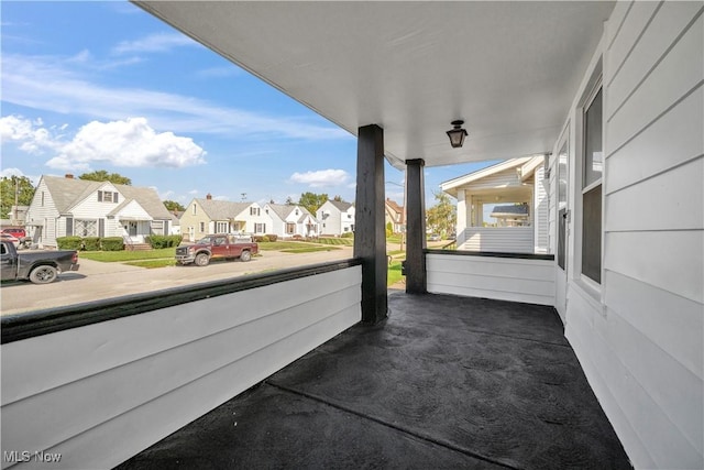 view of patio / terrace featuring a residential view and covered porch