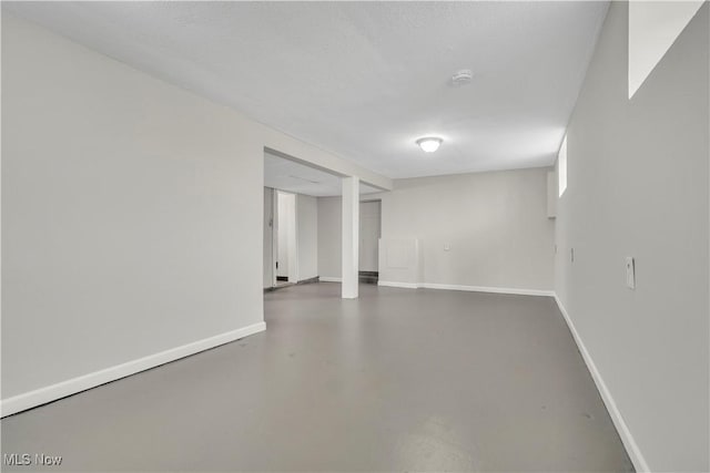 finished basement featuring baseboards