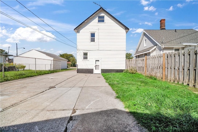 back of house featuring fence