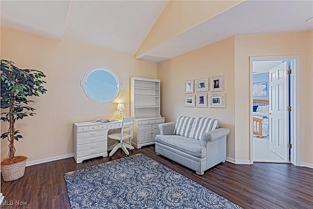 sitting room featuring vaulted ceiling, baseboards, and dark wood-style flooring