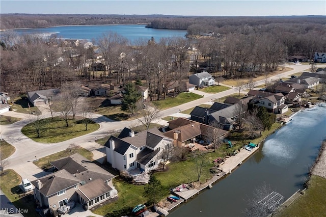 drone / aerial view with a residential view and a water view