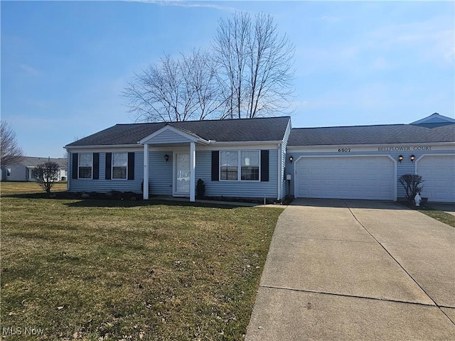 single story home featuring a garage, concrete driveway, and a front yard