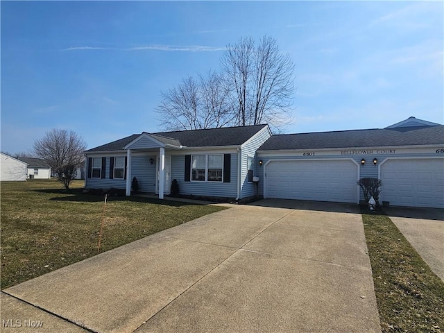 view of front of home featuring concrete driveway, roof with shingles, a garage, and a front yard