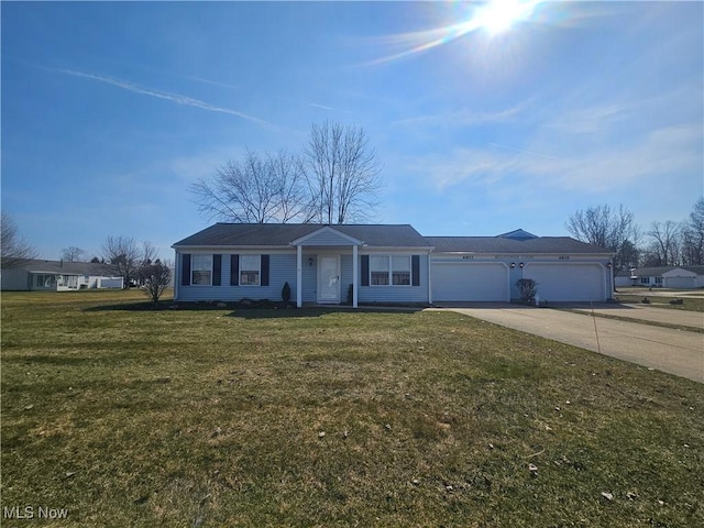 ranch-style home with a garage, concrete driveway, and a front lawn