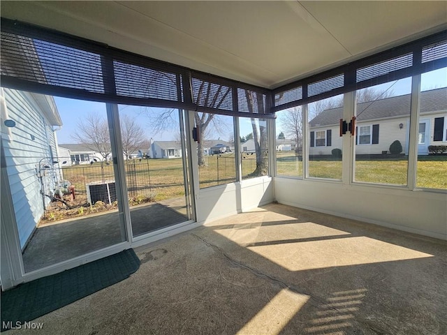 unfurnished sunroom featuring a residential view