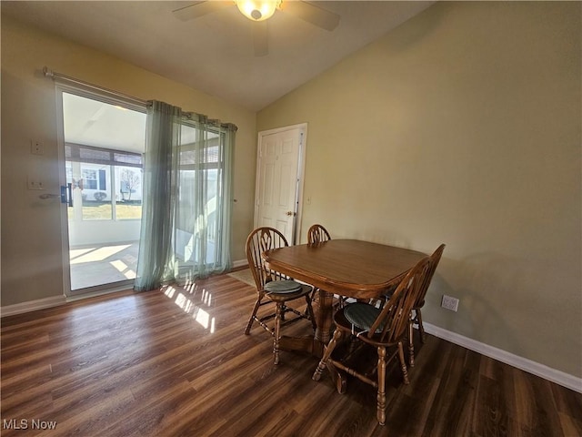 dining area featuring wood finished floors, baseboards, lofted ceiling, and ceiling fan