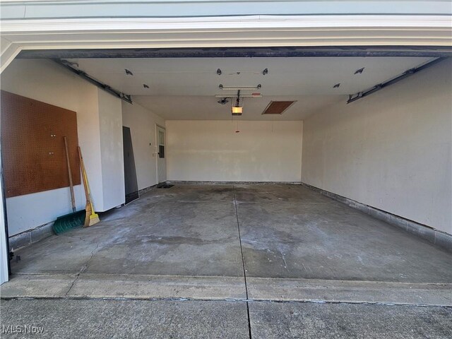 garage featuring a garage door opener