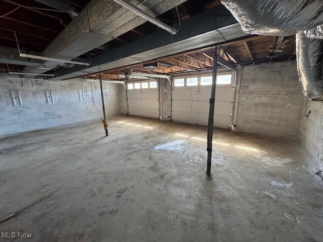 interior space with concrete block wall