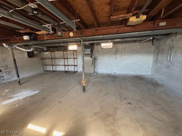 unfinished basement featuring heating unit