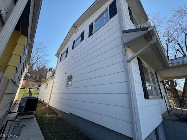 view of side of property featuring cooling unit