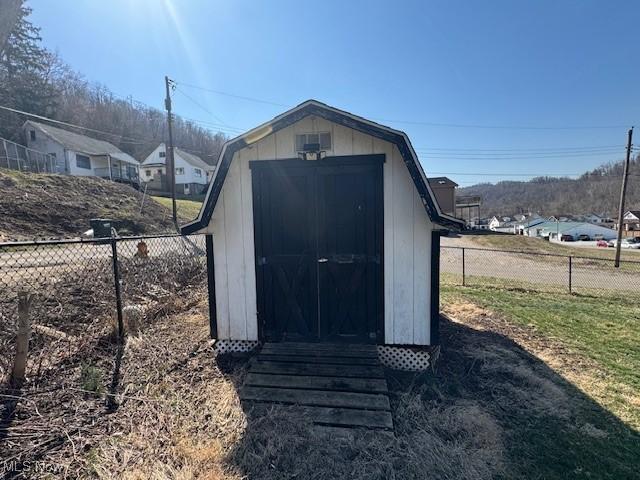 view of shed featuring a fenced backyard