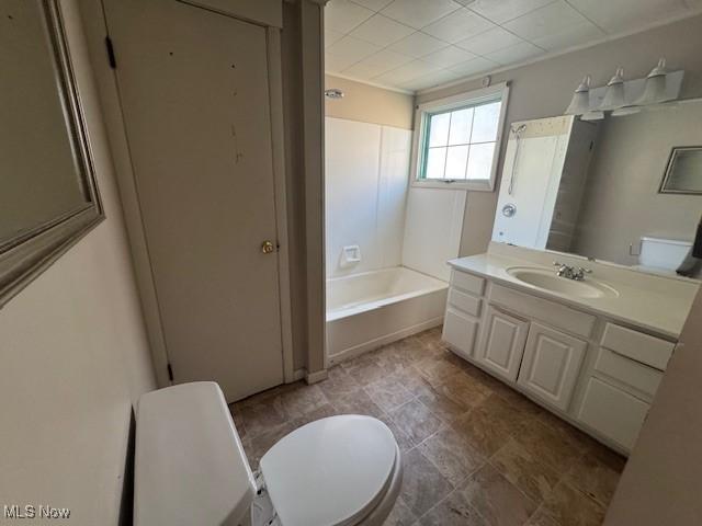 full bath with vanity, toilet, and shower / washtub combination