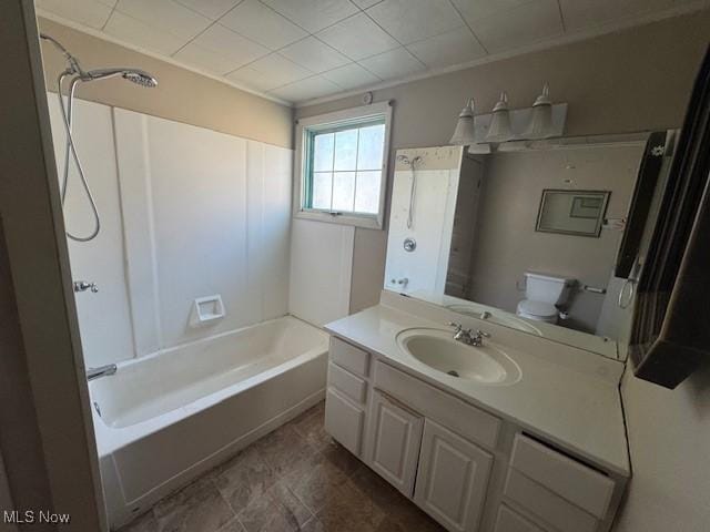 bathroom with vanity, toilet, and shower / washtub combination