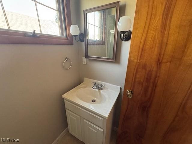 bathroom with a wealth of natural light and vanity