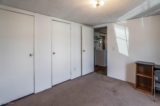 unfurnished bedroom featuring a textured ceiling and carpet floors