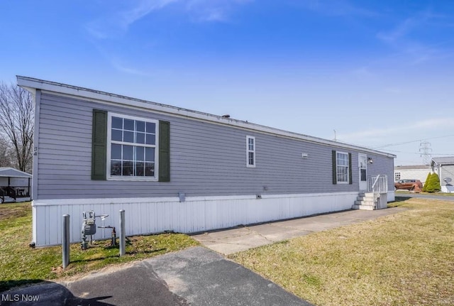 view of property exterior featuring a yard