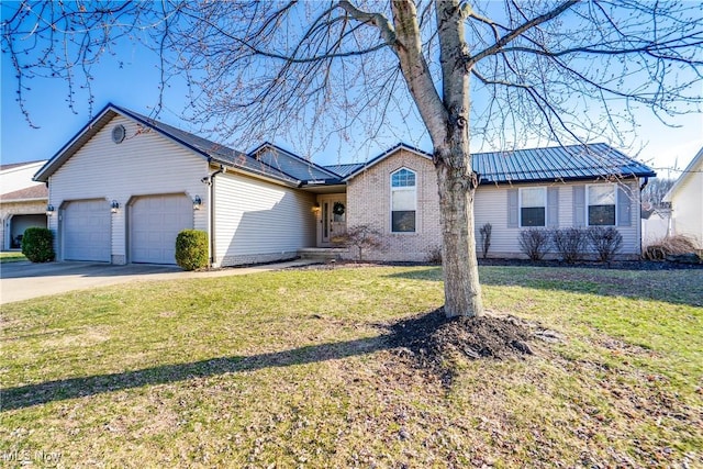 ranch-style home featuring brick siding, a front lawn, metal roof, a garage, and driveway